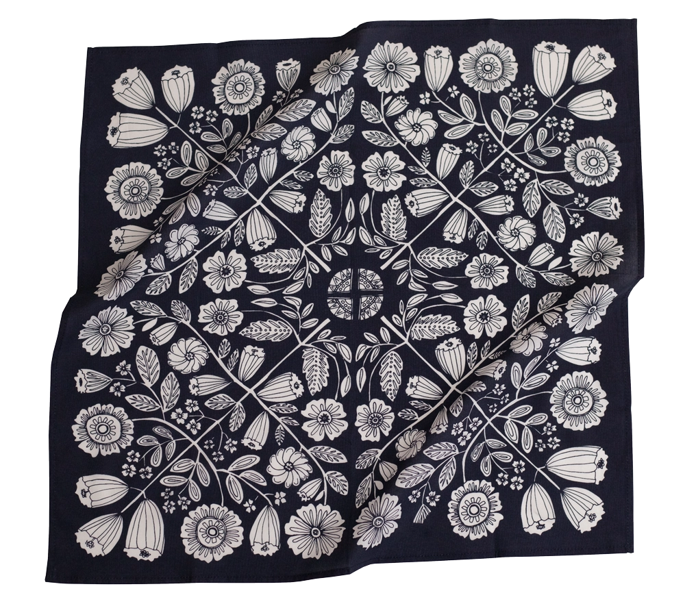 This image features a **square fabric bandana** with an **intricate white floral pattern** on a deep navy blue background. The design is highly detailed and symmetrical, showcasing various flowers, leaves, and botanical elements radiating from the center. The pattern has a vintage, folk-art-inspired aesthetic, making it a stylish and versatile accessory for wearing as a headband, neck scarf, or decorative piece. The fabric appears soft and lightweight, perfect for everyday wear.