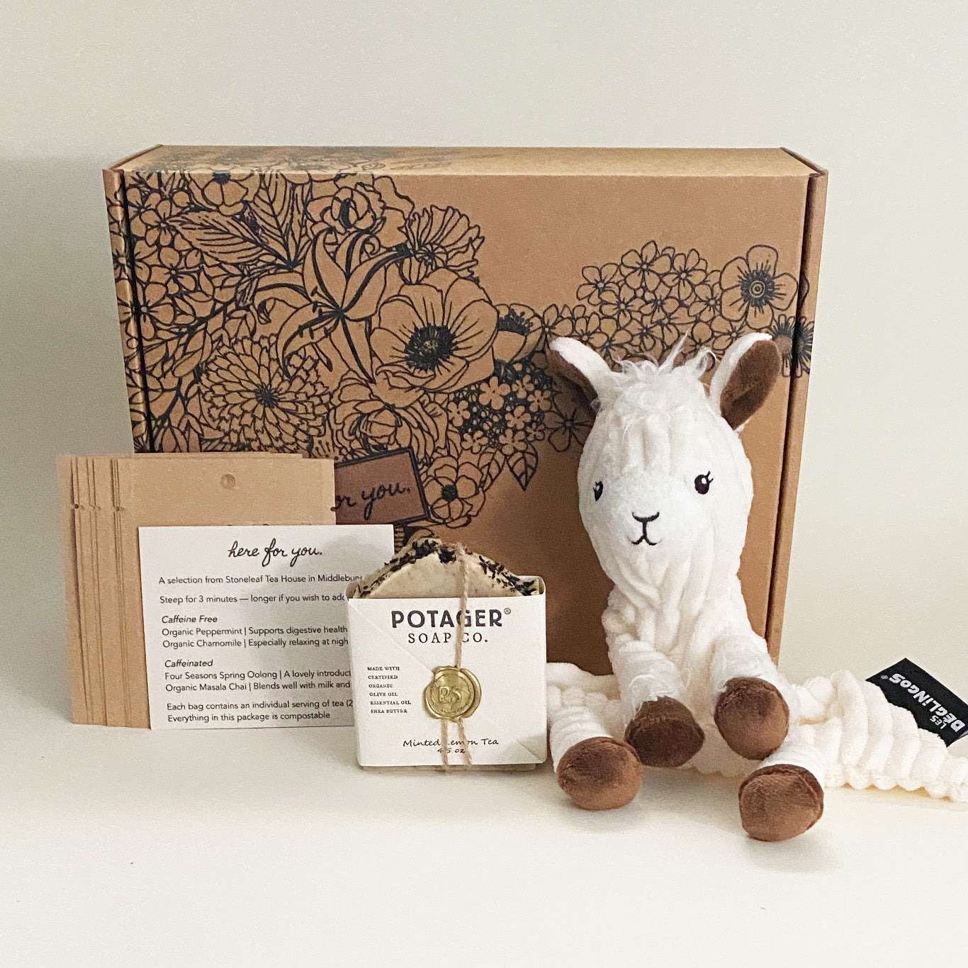 This **Here For You Essentials** care package is a **gentle, comforting gift** perfect for **birth, adoption, or major life transitions**. It includes **organic herbal tea, handcrafted Potager Soap, and a soft llama plush**, all packaged in a beautifully designed box. Thoughtfully curated for relaxation and support, this set provides **a small but meaningful gesture** to remind someone they are loved and cared for.