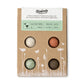 Box of organic seeds with three round seed bombs on a white background