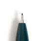 A close-up of a green pen with a gold clip and tip, shown with its cap removed to display the 0.7mm medium point tip.