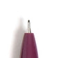 A burgundy pen with a matte finish and gold detailing, shown with cap off and pen tip exposed.