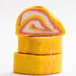 Stack of three bubble bars. Exterior is yellow with white and red swirls